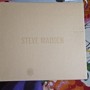 A women's Black/Paris pair of Steve Madden Vakay Boots size 11, 3.25 inch heels.